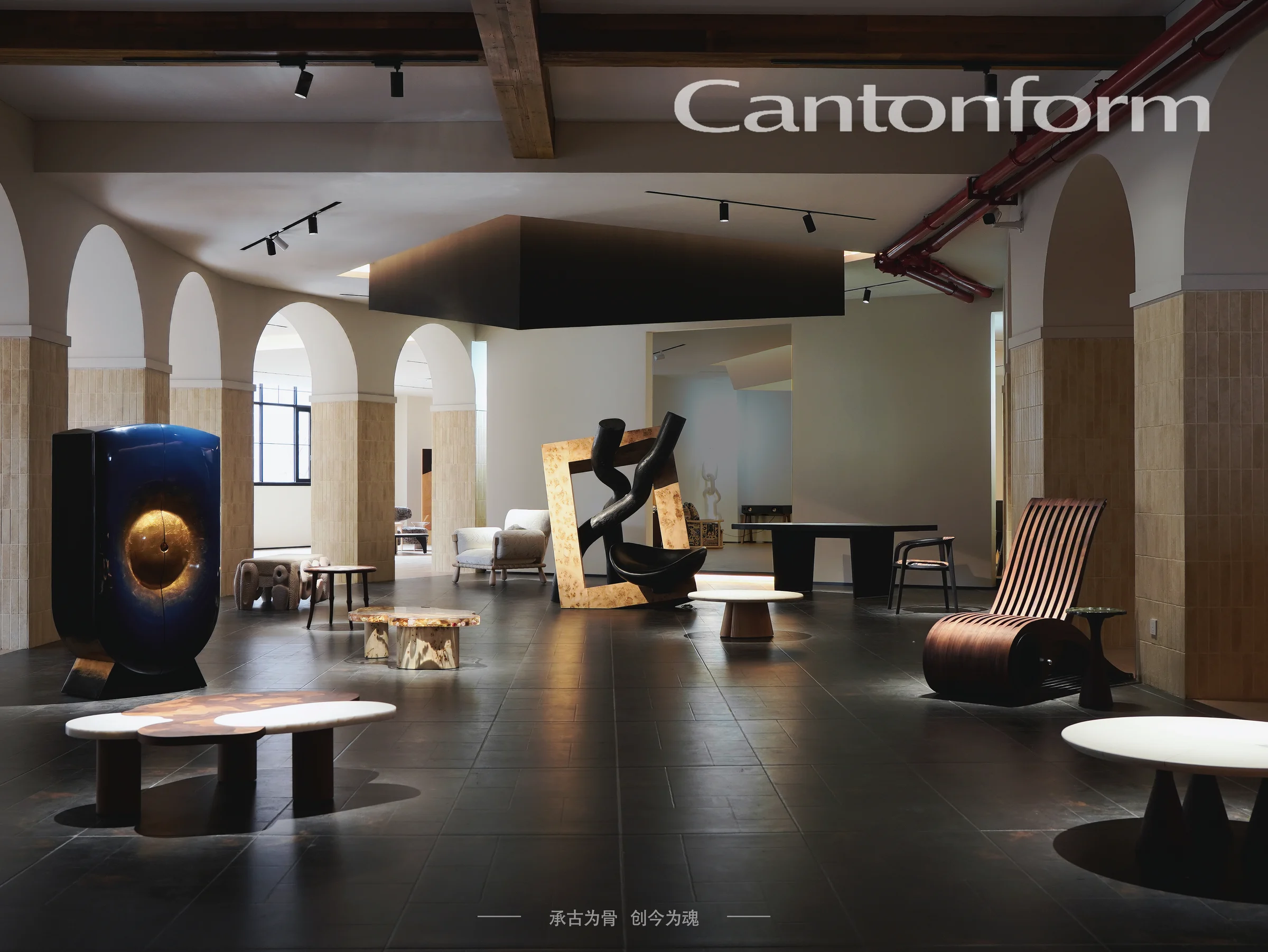 Cantonform showroom with arched columns, sculptural cabinets, stone tables and curved wooden seating